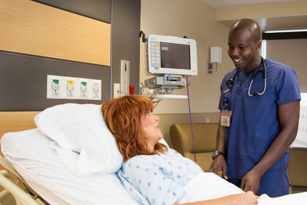 African-American male nurse with patient, right aligned